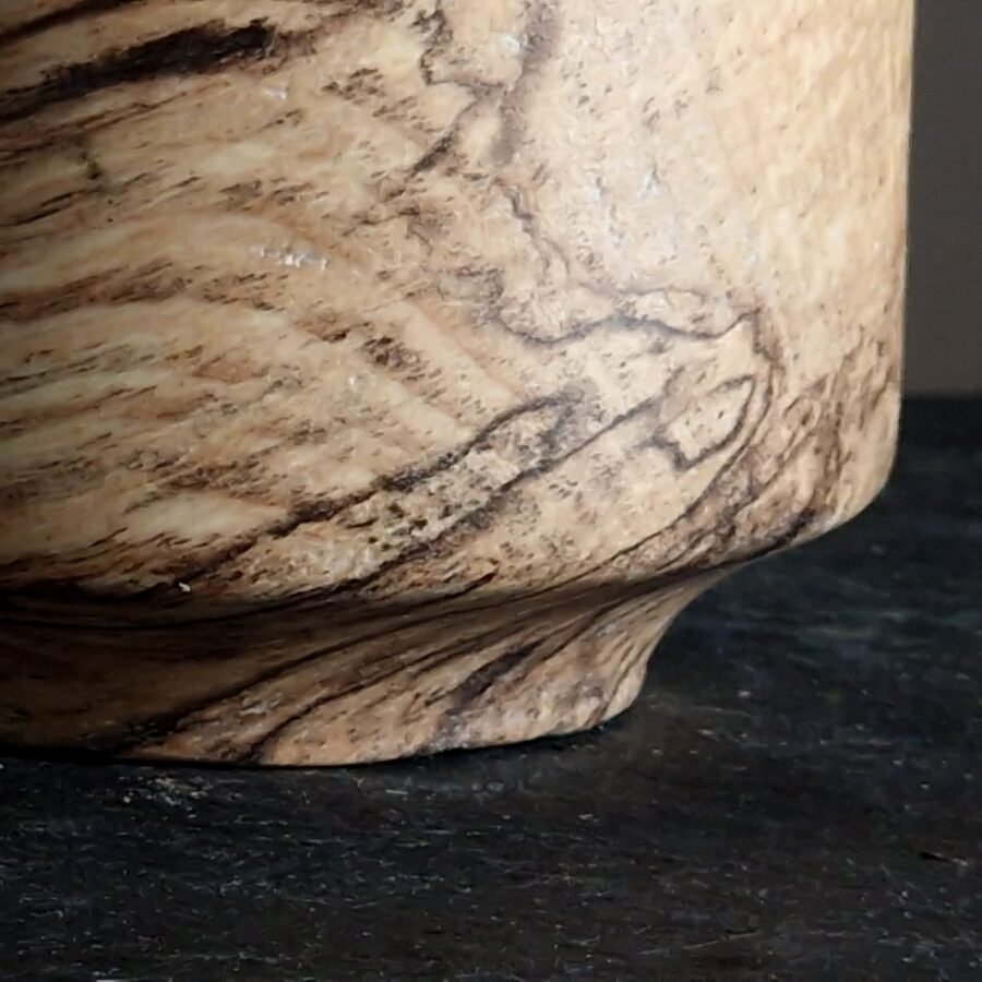 Close up detail of grain on spalted ash vessel