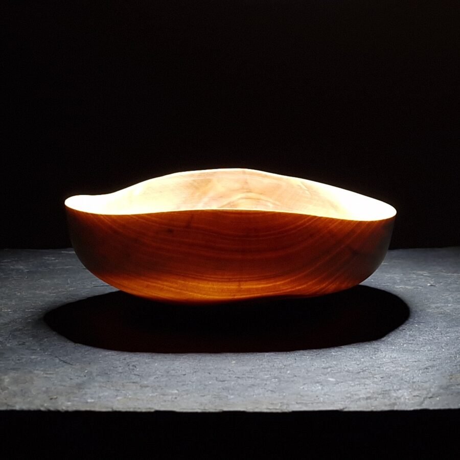 Light shining through finely turned Birch Bowl