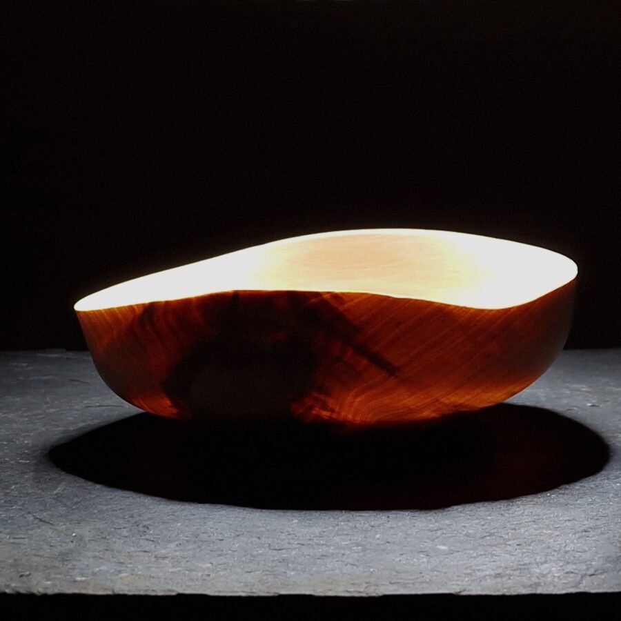 Light shining through finely turned Birch Bowl