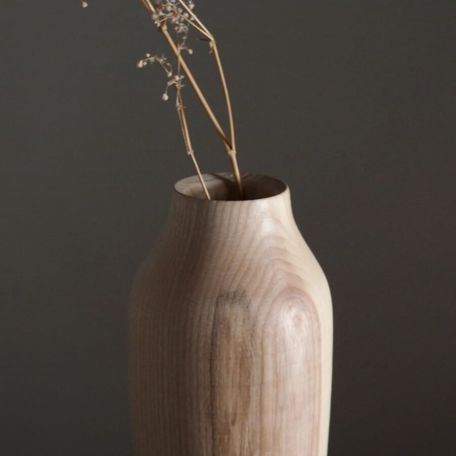 A wooden vase for dried flowers