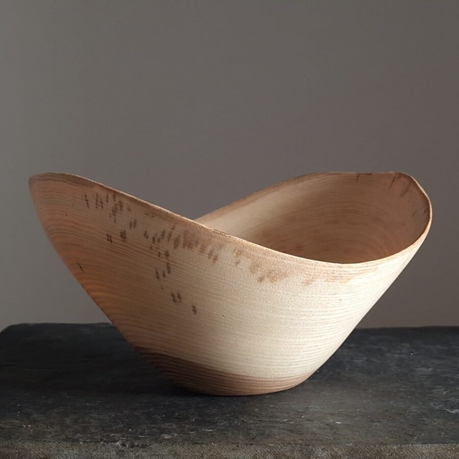 A live edge wooden bowl made from Ash