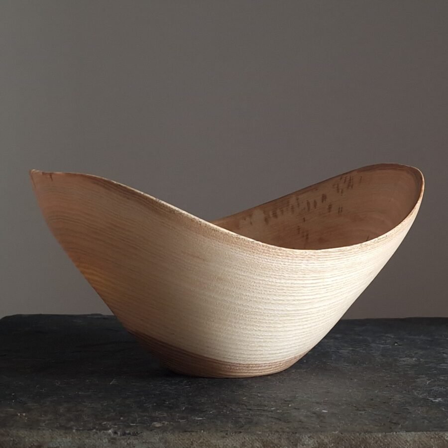 A wooden live edge bowl made from Ash